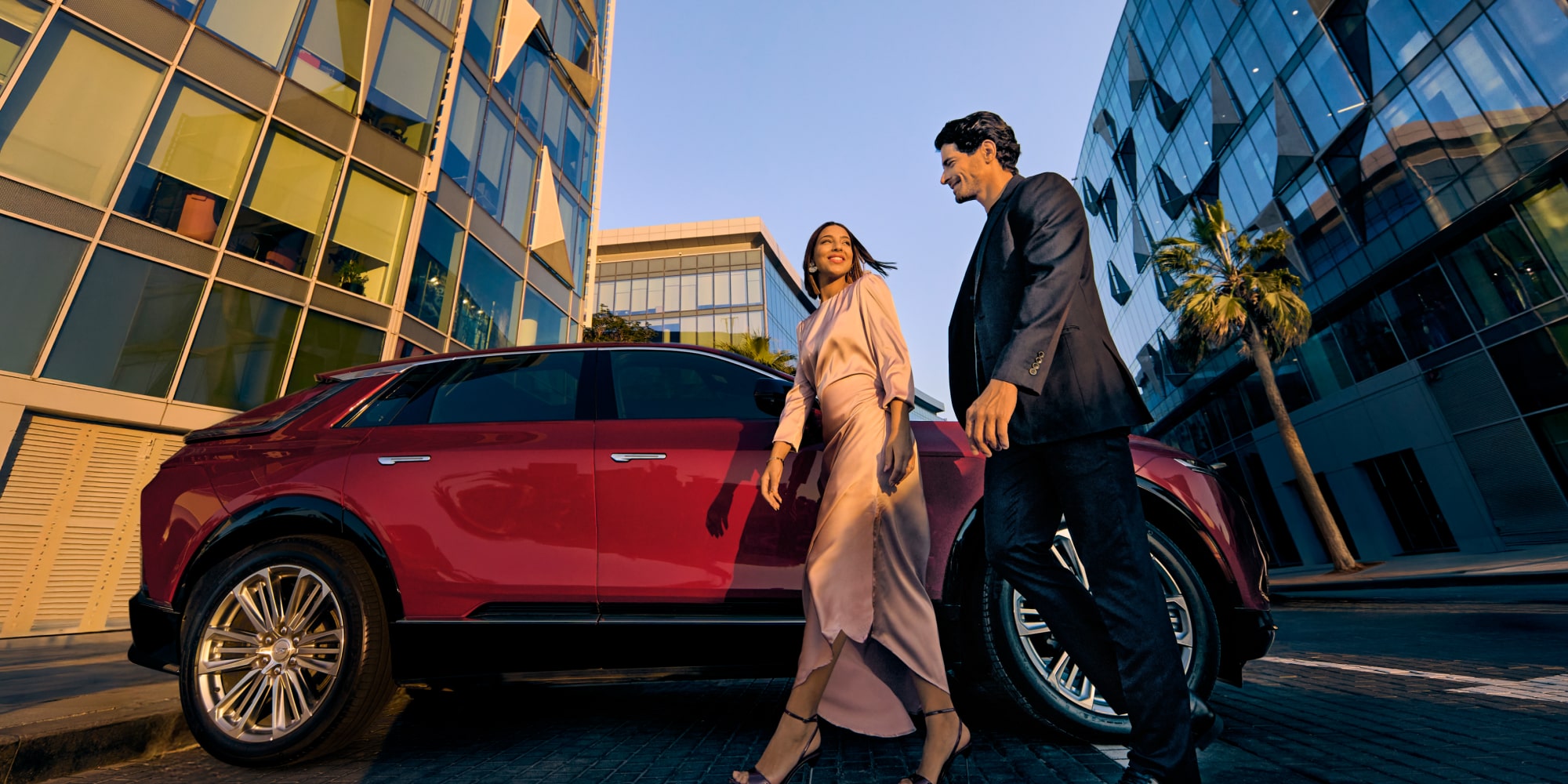 A smartphone displays the mobile app with a "Roadside Assistance" button highlighted at the bottom of the screen.