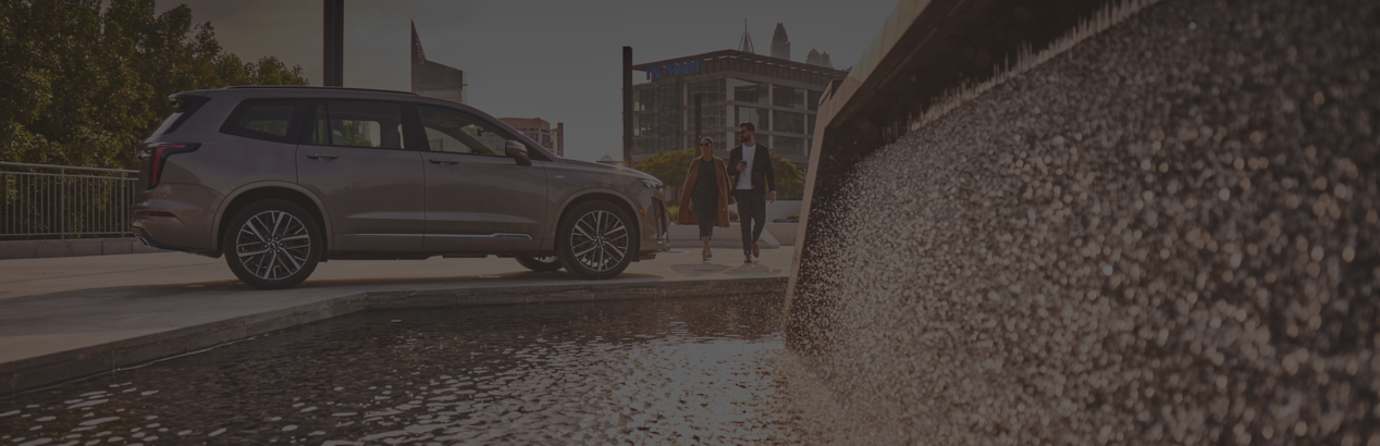 Man and Woman walking towards the vehicle