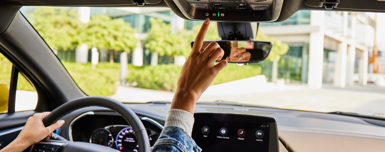 Hand clicking on OnStar button